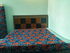 Wooden bed and mattress