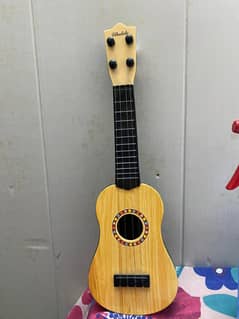 mini guitar used for studio decorations