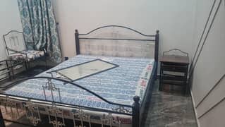 bed set with two chairs and mattress