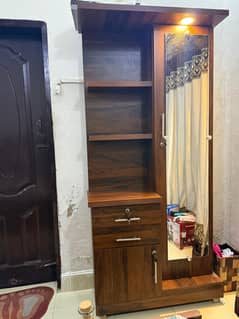 Dresser with warm light available for urgent sale