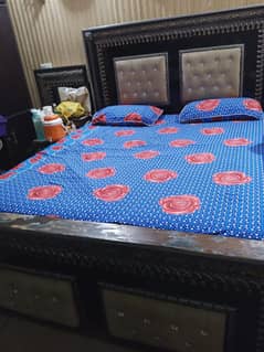 king size bed with side tables and showcae
