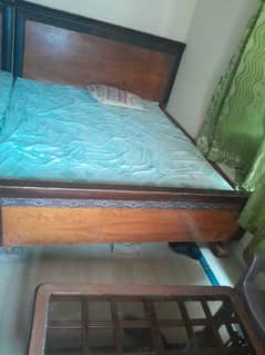 double bed with side tables and dressing table
