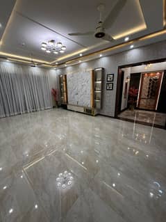 1-Kanal Impeccably Designed Brand New Bungalow with 5 Bedrooms (All Attached Baths), Drawing/Dining, Sun-Filled Ventilated Spaces, and Wide Carpeted Road Access Located in the Prime Block FF of DHA Phase 4 Brought to You by Emarat