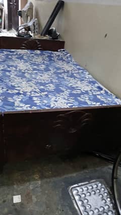 wooden single bed