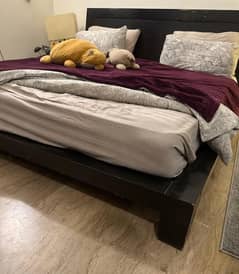 King sized bed with side table