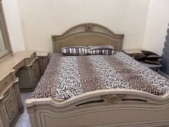 Bed with side tables and dresser