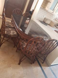 light brown imported cane dinning table with 6 chairs