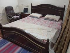 Six years used wooden bed with mattress.