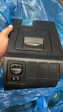 Corolla grande mirror adjusting console
