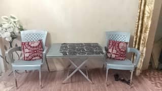plastic chairs with table