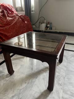 brown wooden leg coffee table with glass top