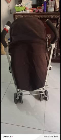 A comfortable, folded, adjustable, pram in good condition