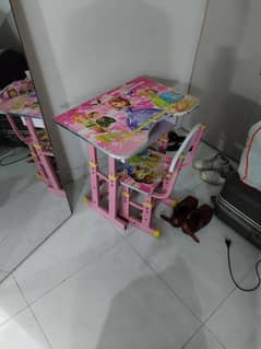 Kid playing and study y table