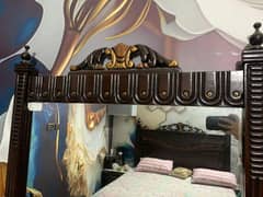 bed with side tables and dressing mirror and spring metress