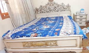 king size bed without mattress with cupboard and side table