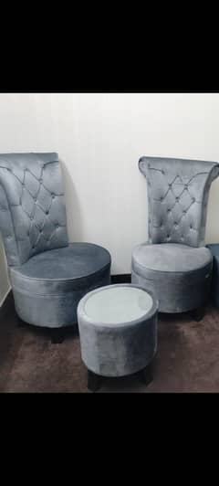 2 chairs with round table