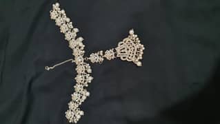 maatha patti or earrings