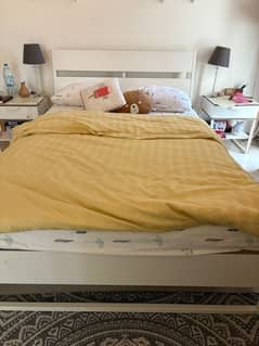 Queen size bed with tables