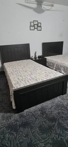 2 black mat polished single beds