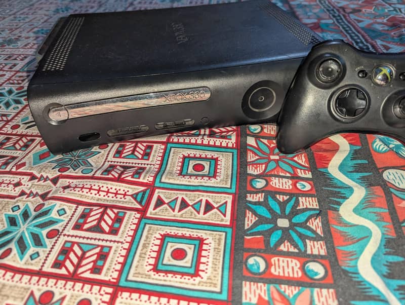 x box 360 with controller with 50 gmaes 0