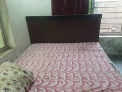 i m selling my wooden bed with mattess