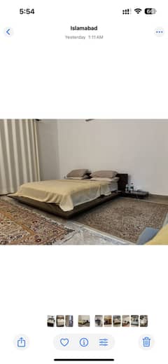 Wooden bed with side tables