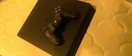 PS4 slim with two controllers and 1 game