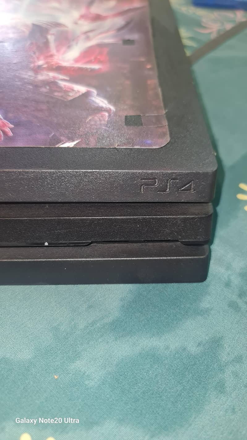 ps4 pro 1tb with two controllers and ps4 two cds 1