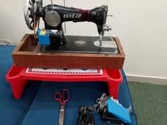 Sewing machine, scissor, paddle and a multipurpose plastic table
