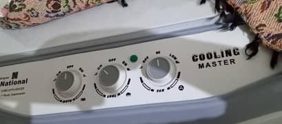 National air cooler with ice bottles