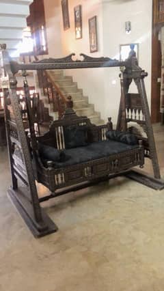 crafted wooden swing  ( jhula )