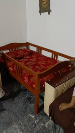 2 single wooden bed