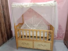 baby cot and baby swinger