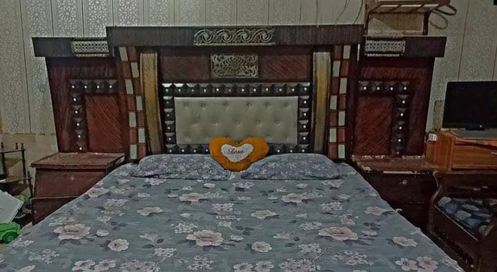 Stylish king size bed for comfortable sleeping with two side tables 1