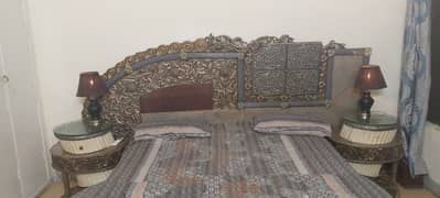 King size bed with side tables and dressing table chair