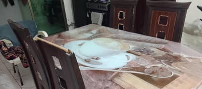 4 seater wooden dining table with tampered glass top for sale