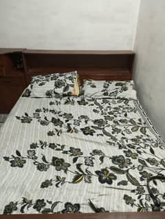 one bed and two side tables
