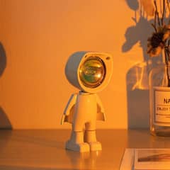 Astronaut lamp sunset and galaxy