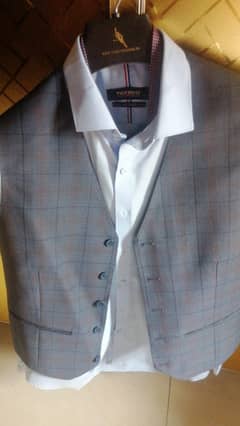 pent coat with waste coat, shirt and tie. . .