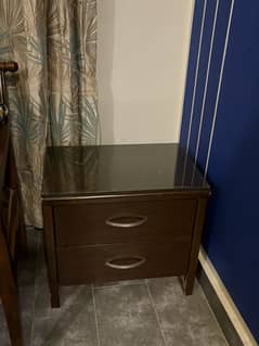 single woden bed with one side table