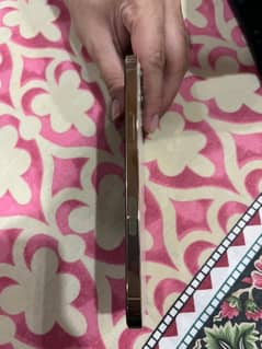 Gold iphone 12 pro max original condition from Dubai