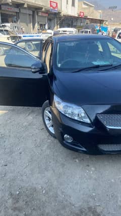Black Corolla 2010 model