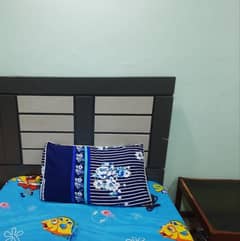 Single bed with mattress and sight table
