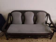 3 seater sofa with 2 wooden chairs