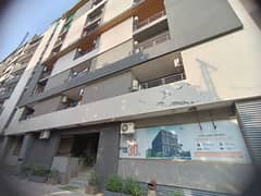 E-11/4 Qurtaba Heights 2 bedroom apartment for sale in family building.