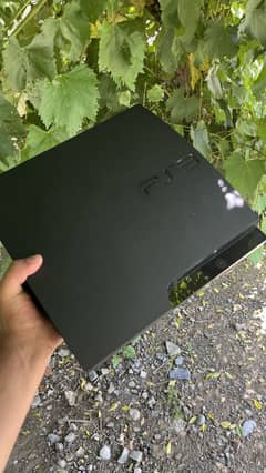 Playstation 3 with 7 games installed and with a  wireless controller