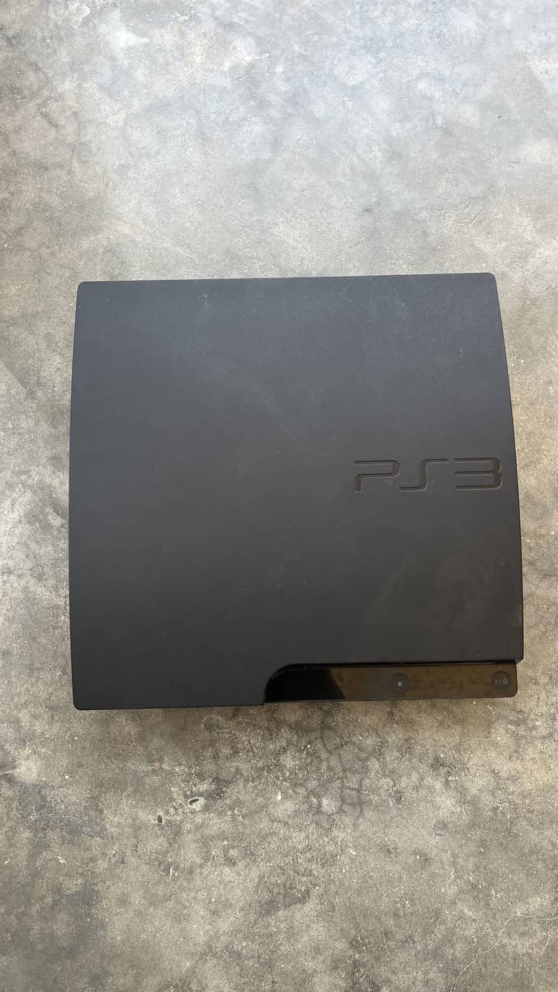 Playstation 3 with 7 games installed and with a  wireless controller 3