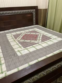 wooden dark brown bed without mattress