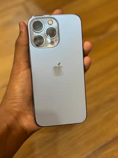 iPhone 13 Pro with charger