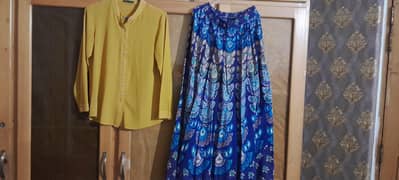 Stylish Yellow shirt with Peacock print maxi skirt. . . formal dress